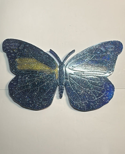 Large blue butterfly with subtle gold accents